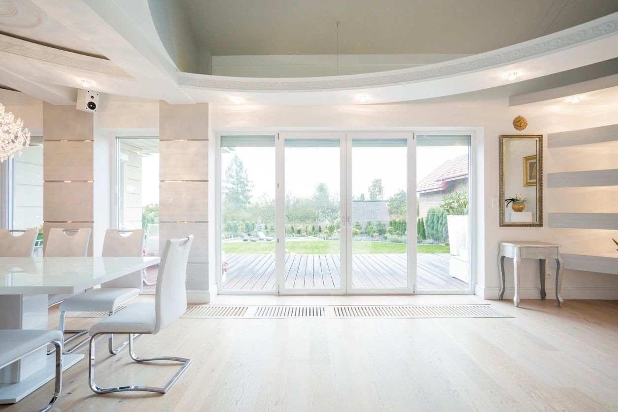 Bright modern dining room with sliding glass doors